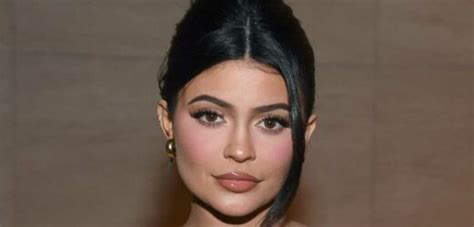 Kylie Jenner bares her thong in sheer dress .